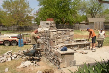 Kodiak Masonry (Coweta, Oklahoma) installing faux stone